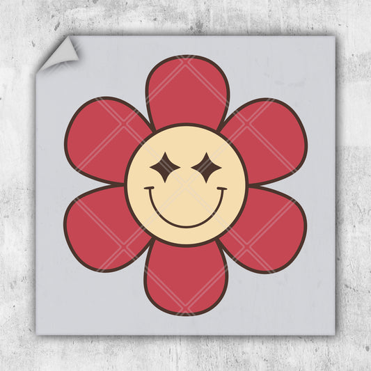 a red flower with a smiley face drawn on it