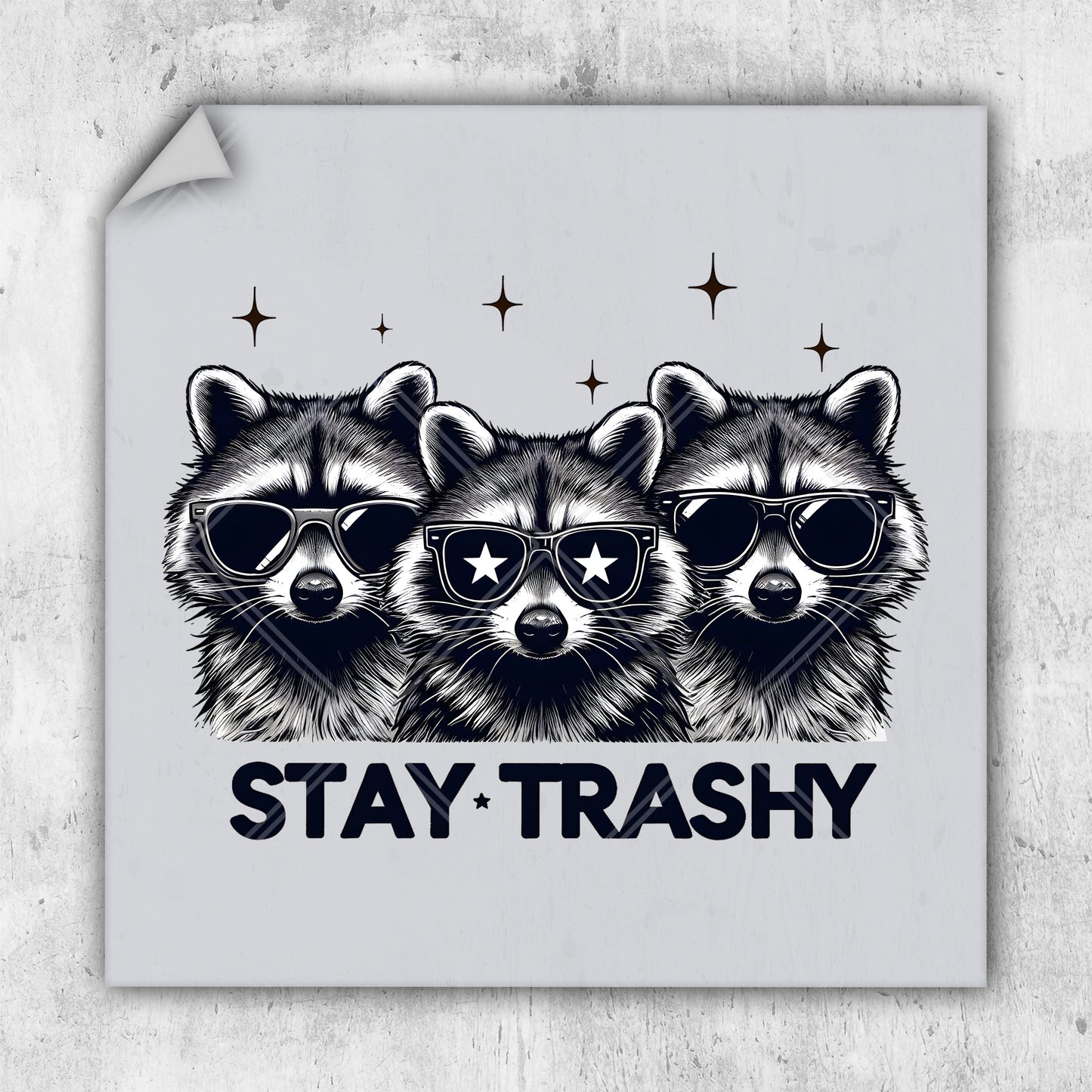 a sticker with three raccoons wearing sunglasses and the words stay trashy