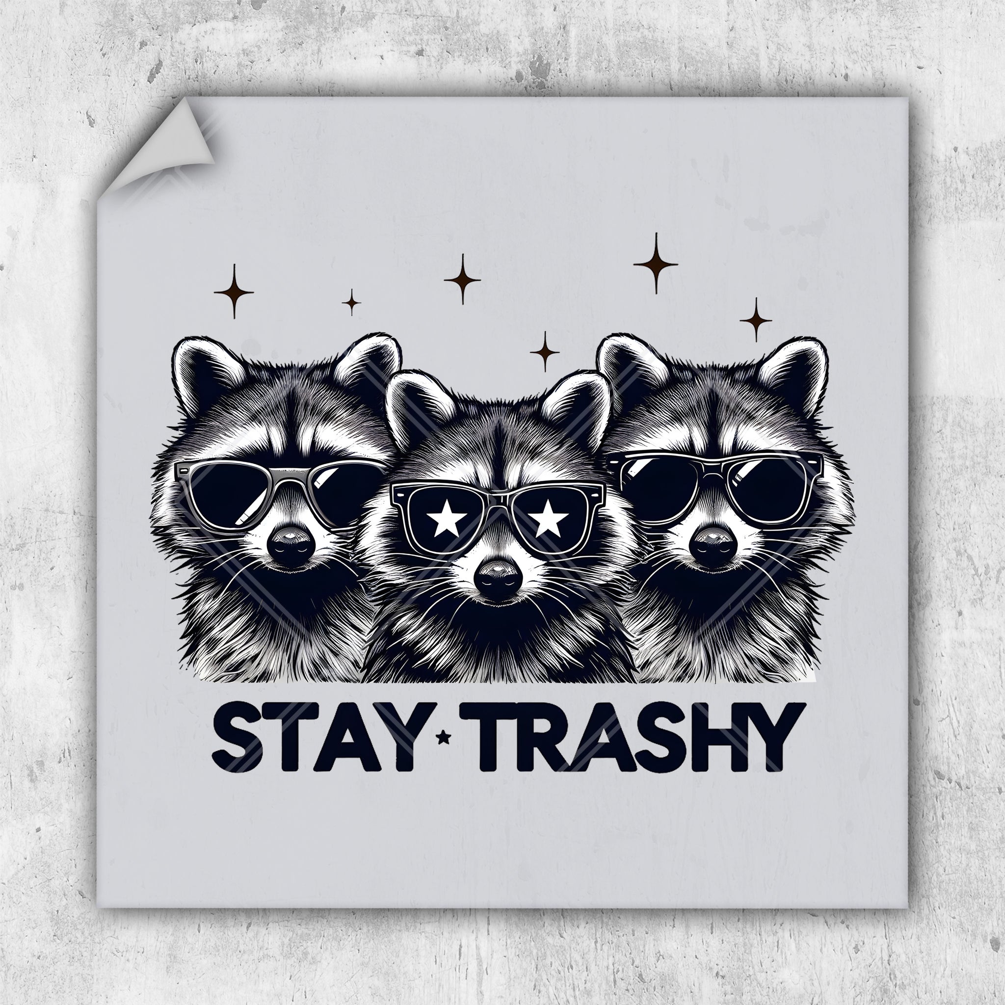 a sticker with three raccoons wearing sunglasses and the words stay trashy