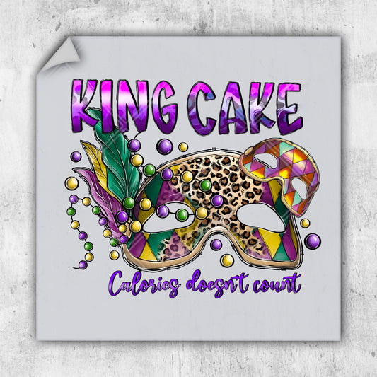 a picture of a mardi gras mask with the words king cake