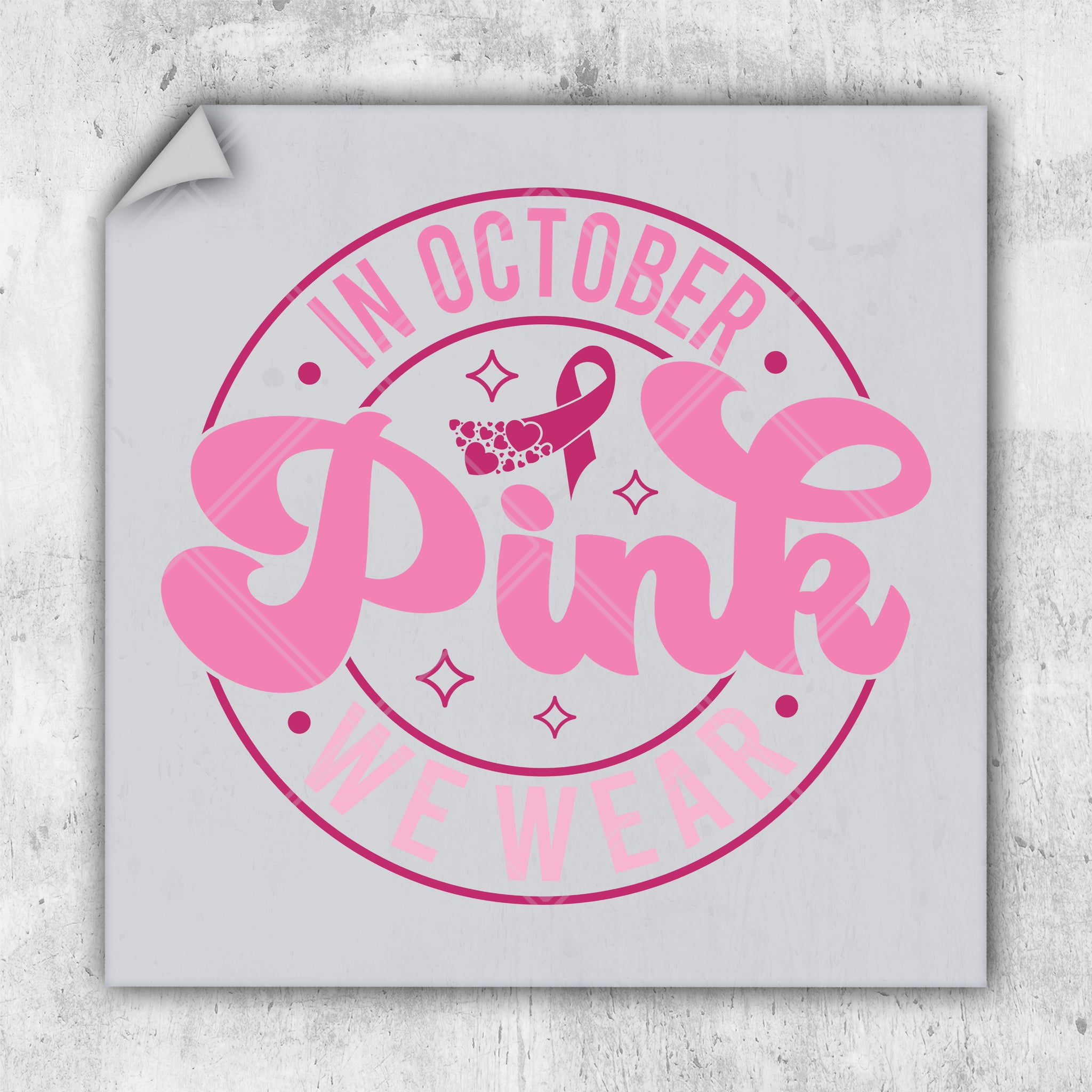a pink sticker with a ribbon on it
