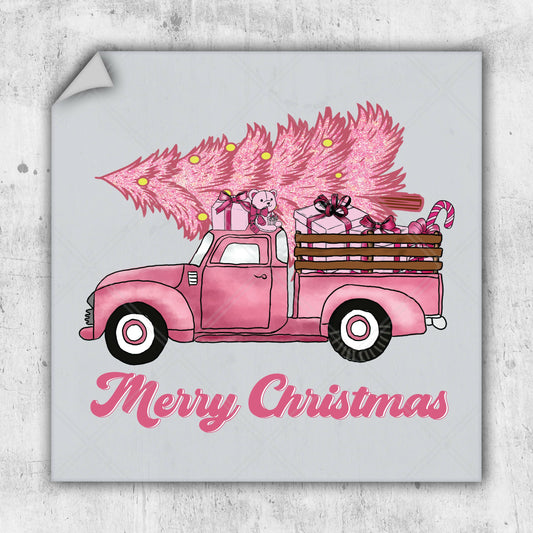 a pink truck with pink christmas trees in the back