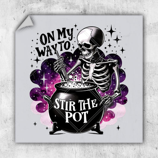 a sticker with a skeleton sitting in a cauldster