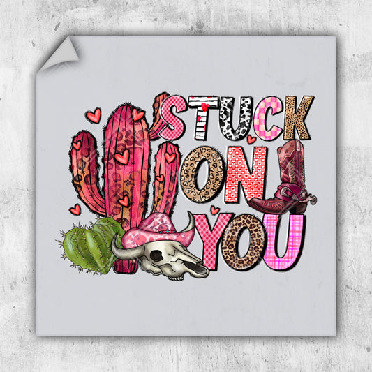 a sticker that says stick on you next to a cactus