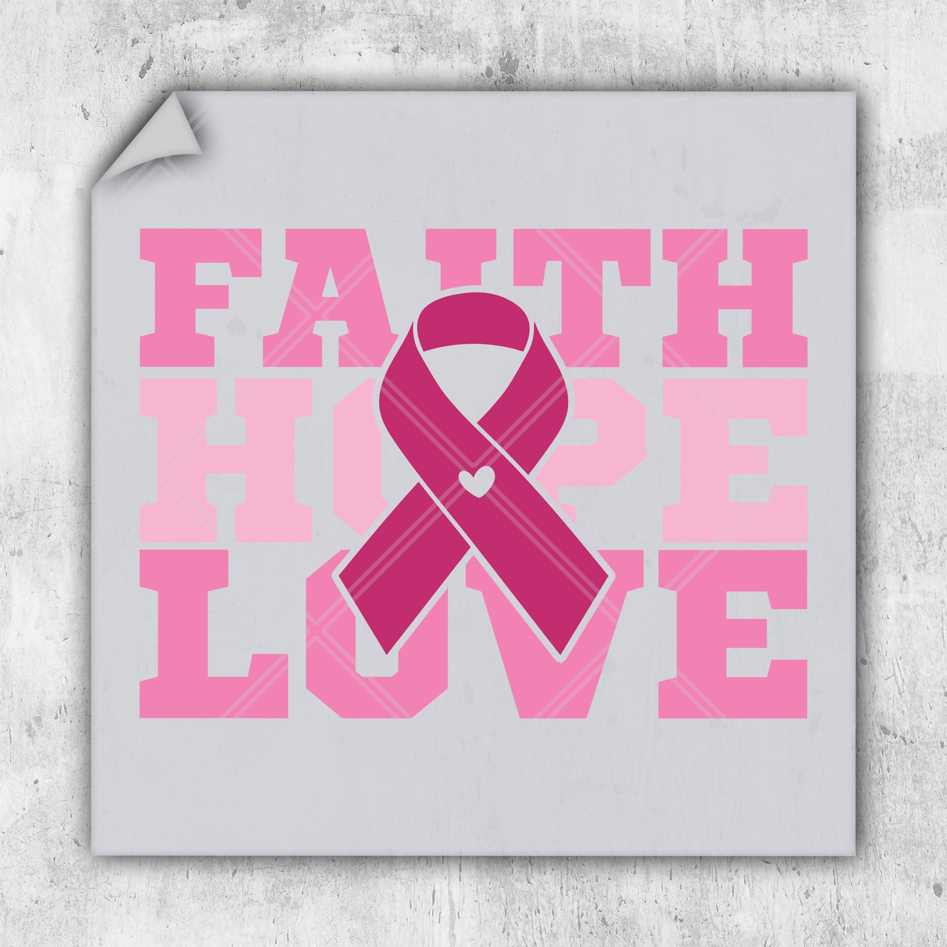 a pink ribbon with the words faith, hope, love