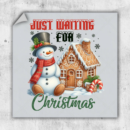 a christmas postcard with a snowman and a gingerbread house