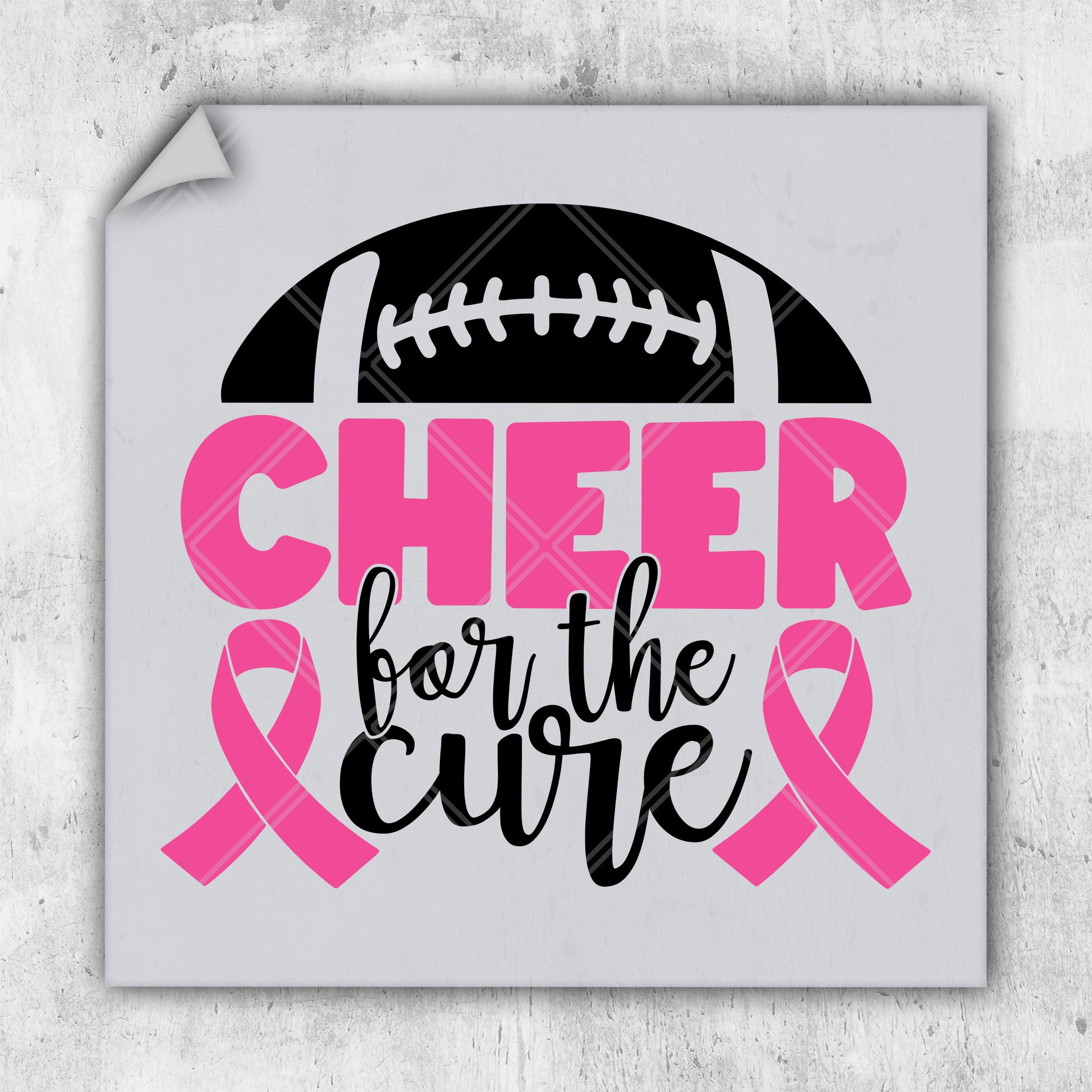 a sticker with a football and pink ribbon on it