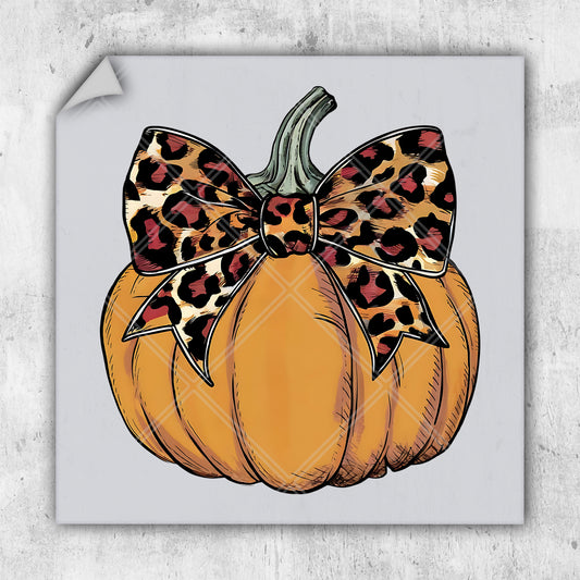 a picture of a pumpkin with a leopard print bow