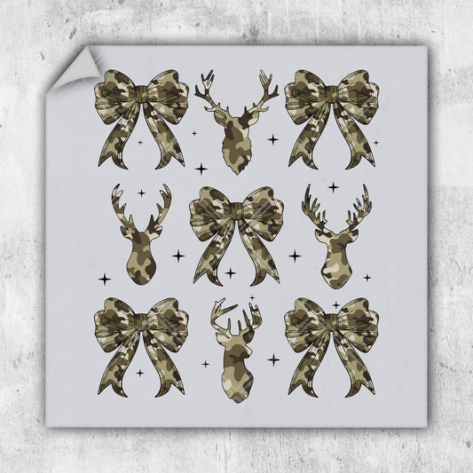 a sheet of paper with bows and deer heads on it