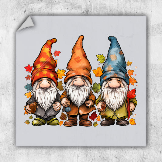 a group of three gnomes standing next to each other