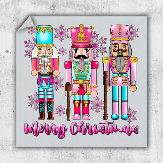 three nutcrackers with a merry christmas message