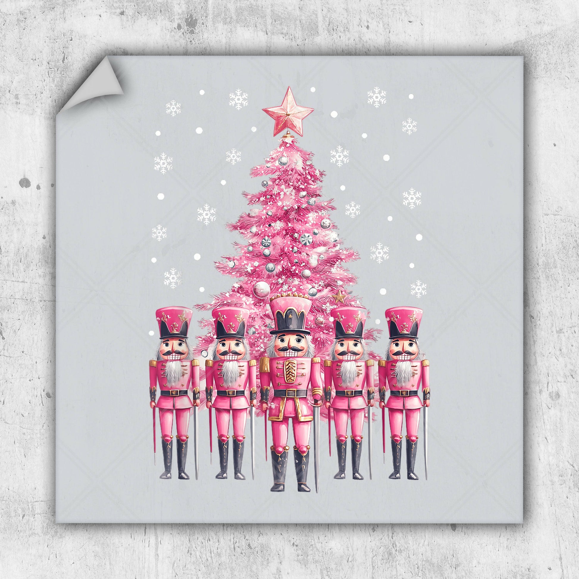 a pink christmas tree with nutcrackers in front of it