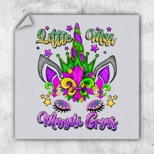 a sticker with a mardi gras mask on it