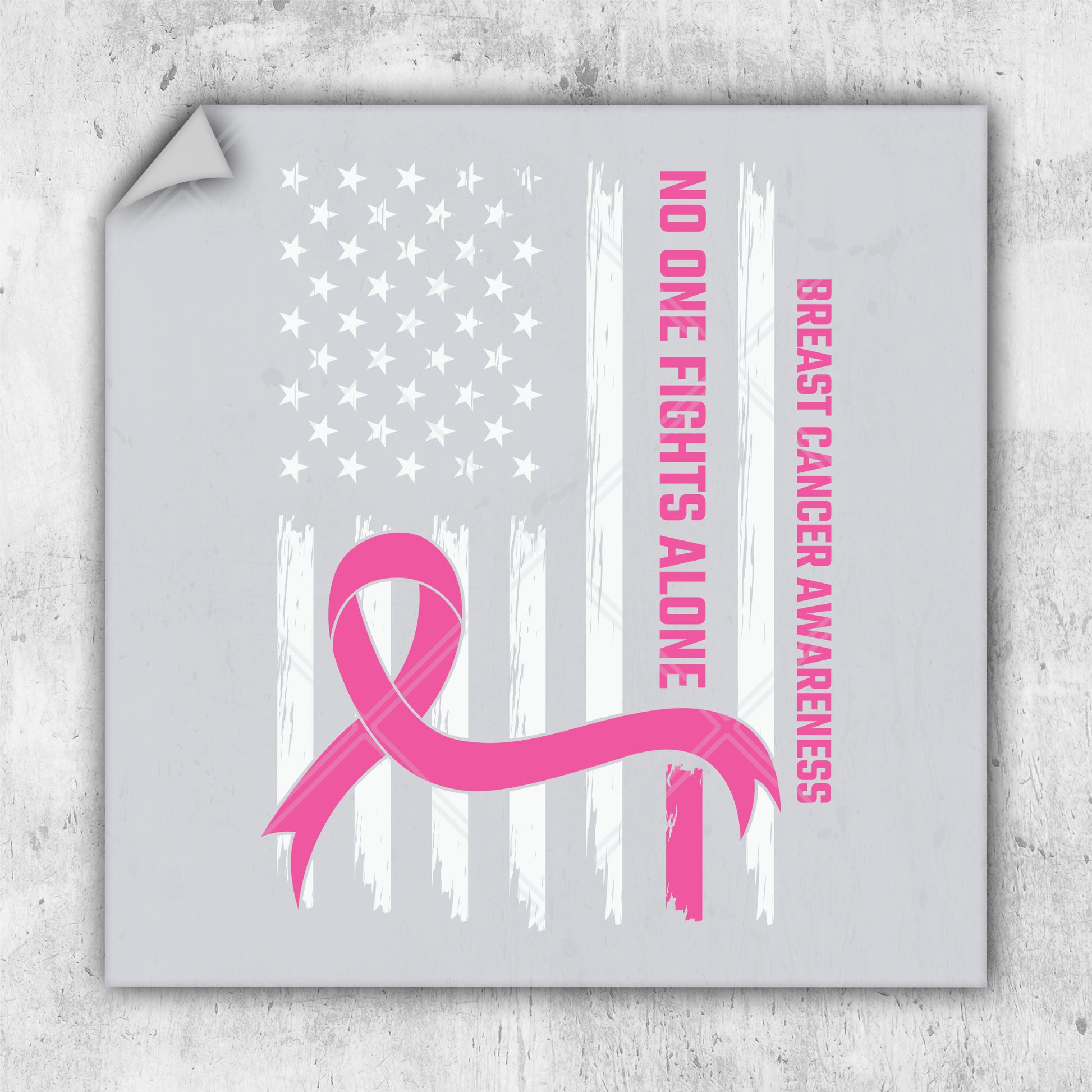 a pink ribbon with the american flag in the background